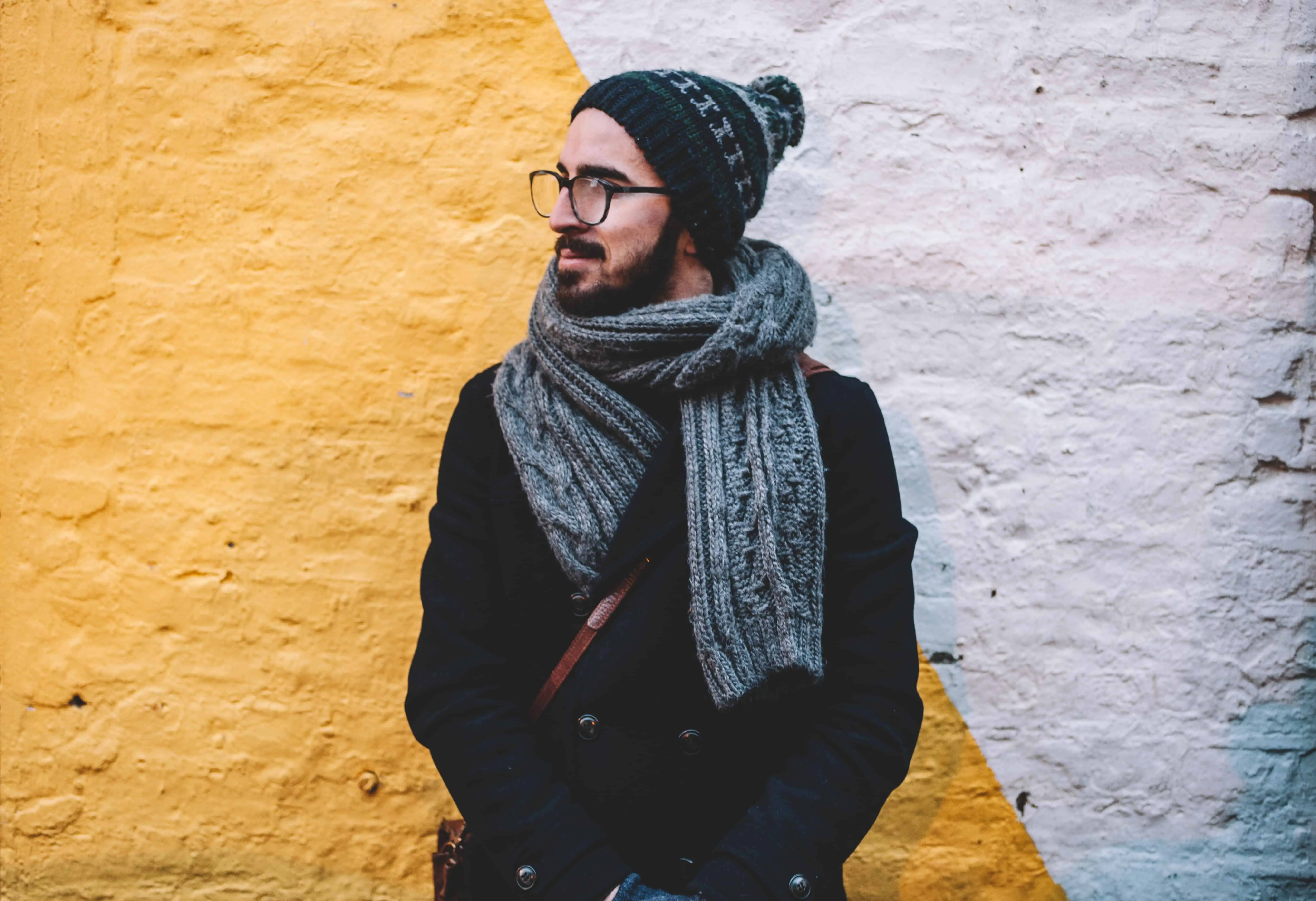 Hipster wearing scarf, hat and eye glasses