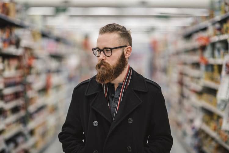 A man walking inside a supermarket