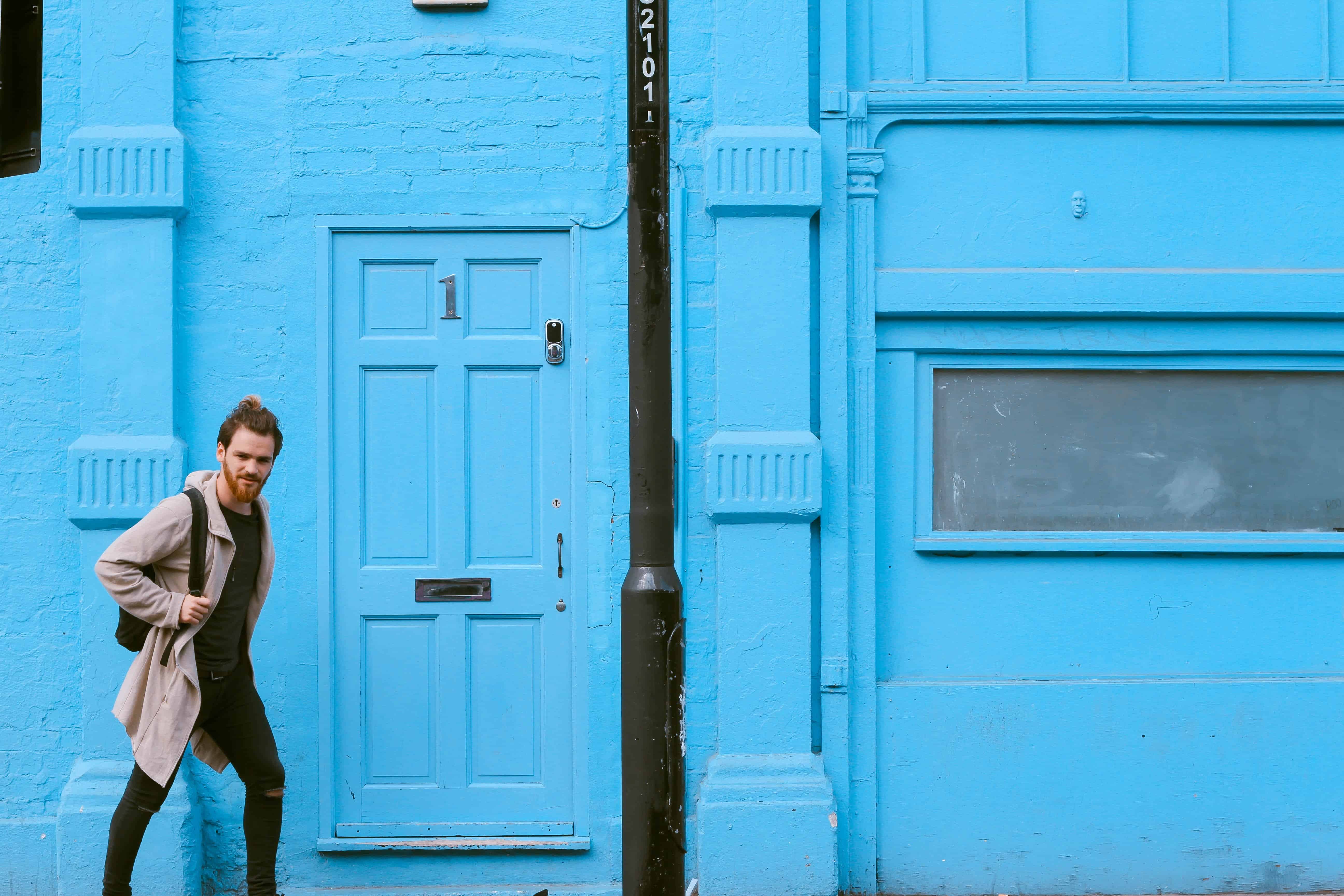 man passing through the door during daytime